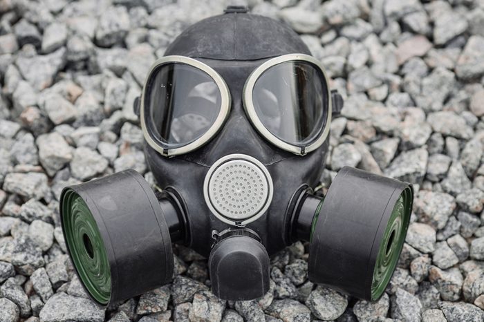 black gas mask on stone background