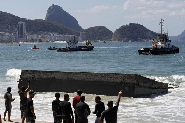People Try to Recover a Part of the Starting Platform For the Marathon Swimming During the Rio 2016 Olympic Games at Copacabana Beach in Rio De Janeiro Brazil 13 August 2015 the Structure was Washed Up Ashore Two Days Before the Marathon Swimming Competition Starts the Trainings Had to Be Suspended Due to the Incident and the Beach Area Had to Be Closed Brazil Rio De Janeiro