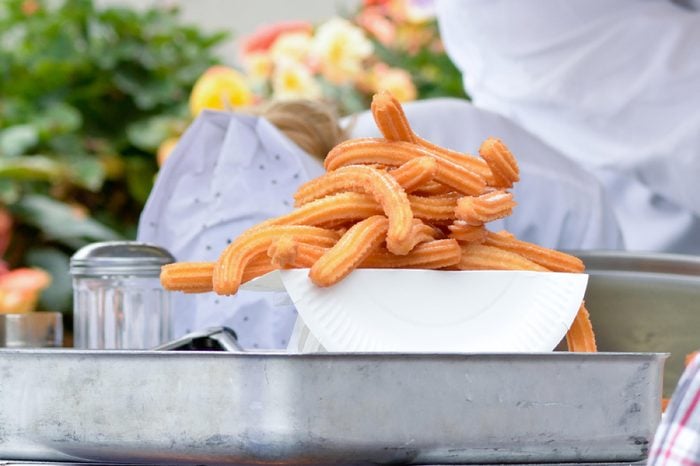 Churros on plate at food stall