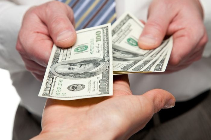 Human hands exchanging money - closeup shot