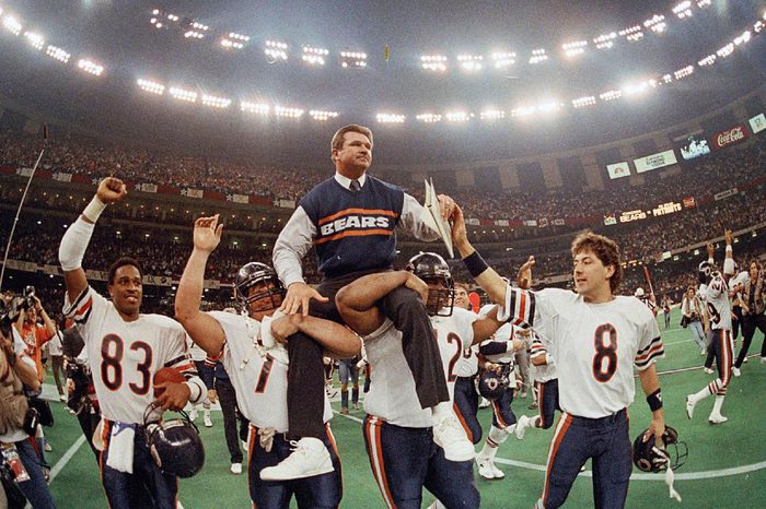 MIKE DITKA Chicago Bears coach Mike Ditka is carried off the field by Steve McMichael, left, and William Perry after the Bears defeated the New England Patriots 46-10 in NFL football's Super Bowl XX in New Orleans. Willie Gault (83) and Maury Buford (8) join the celebration