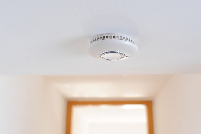 Smoke detector unit sitting on ceiling in private home