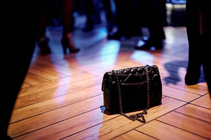 bag on the floor during a dancing in a nightclub