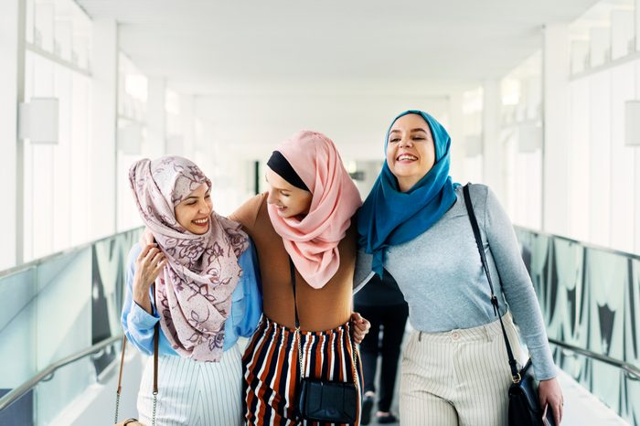 Muslim women talking with friends