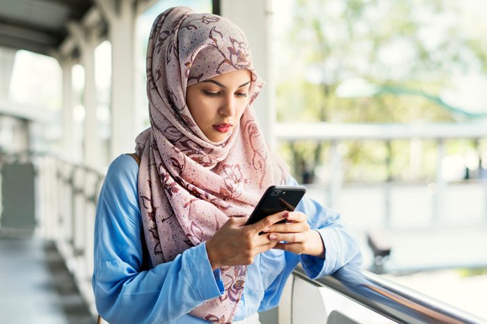 Muslim woman using smartphone