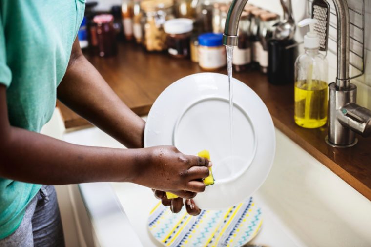 Black woman washing the dish