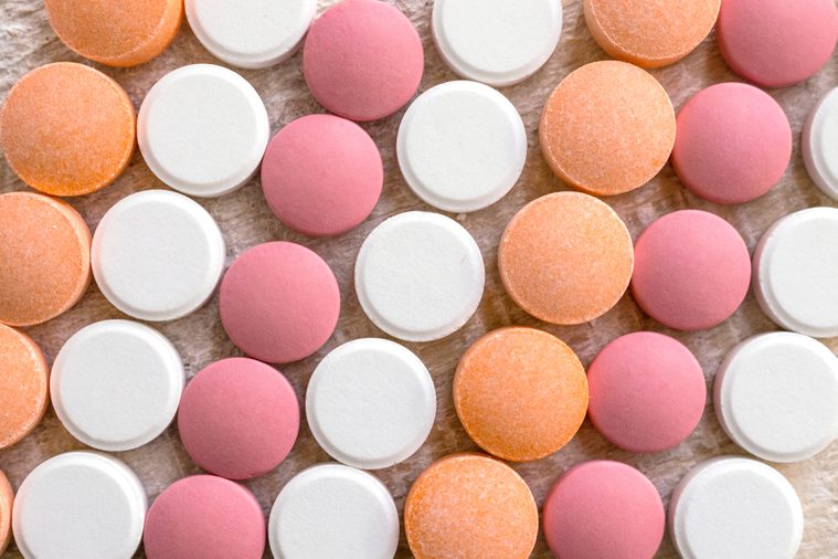 White, pink and orange tablets stripes background. Different Antacids medications help neutralize stomach acid. Antacid Oral : Uses, Side Effects, Interactions, Risks, Warnings