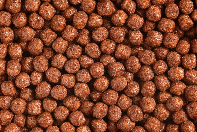 Chocolate breakfast cereal balls background or texture close up macro shot