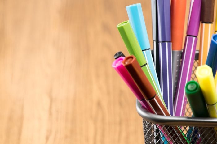 Colorful pen in metal pen pot