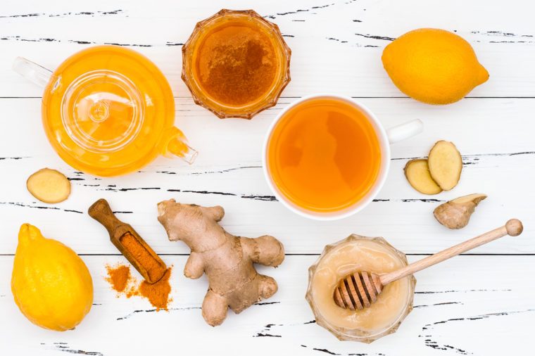 Ginger, cayenne, turmeric and honey on a white table