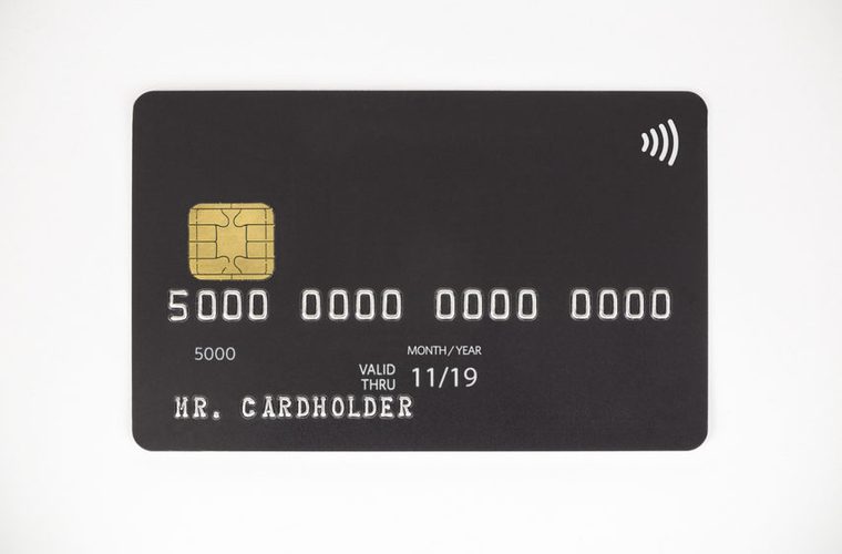Black bank credit card on white background