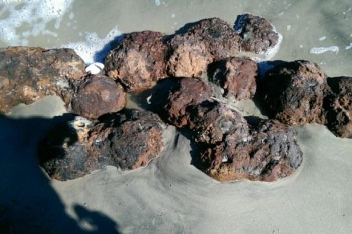 This photo provided by by the Charleston County Sheriff's Office shows Civil War-era cannonballs found, on a beach in Folly Beach, S.C. The County Sheriff's Office bomb squad was called to Folly Beach on Sunday after Civil War-era cannonballs were found on shore, washed up by Hurricane Matthew, Maj. Eric Watson said