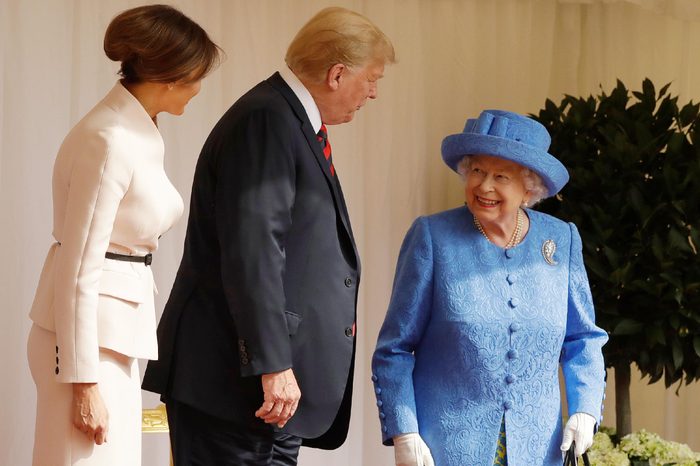 U.S. President Donald Trump and first lady Melania Trump speak with Britain's Queen Elizabeth II on the dais in the Quadrangle of Windsor Castle in Windsor, England