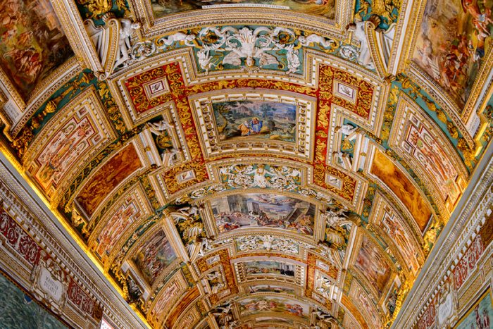 VATICAN, VATICAN CITY - MAY 7, 2016: Paintings on the walls and the ceiling in the Gallery of Maps, at the Vatican Museum. It was established in 1506