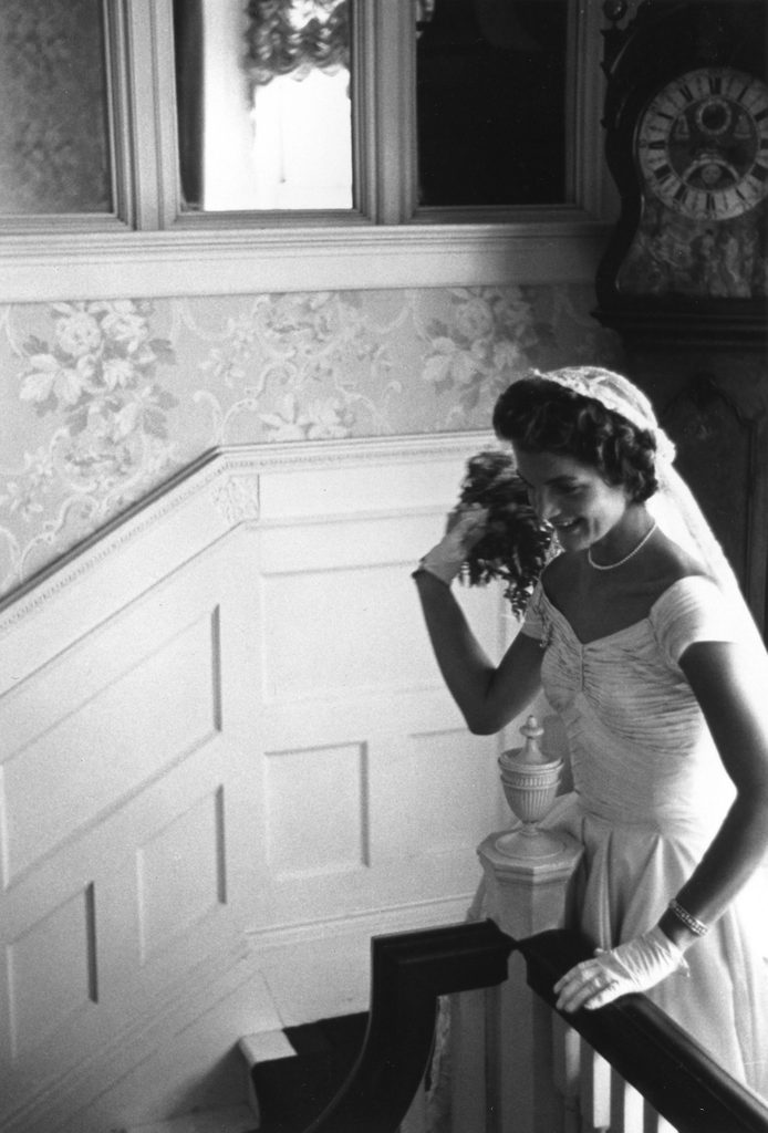 Mrs. Kennedy throws her bouquet