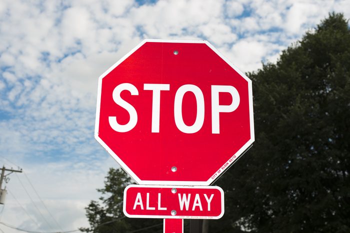 A stop sign against a blue sky.