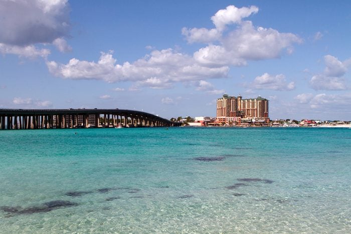 Highway 98 bridge goes across the crystal clear waters of the pass in the resort town of Destin, Florida