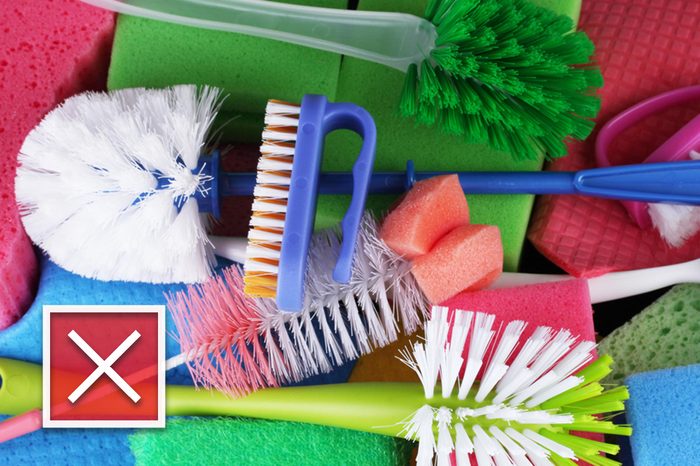 Many colorful sponges and brushes for housework