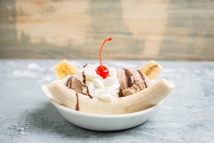 Homemade banana split with on the rustic background. Selective focus.