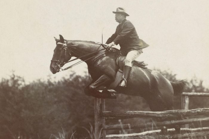 President Theodore Roosevelt, on horseback jumping over wood fences at Chevy Chase Club, 1907. Photo by B.F. Clinedinst