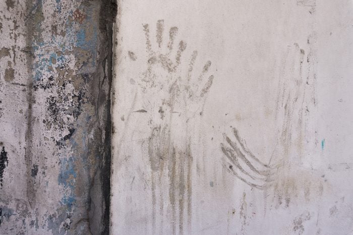 dirty handprints on the wall