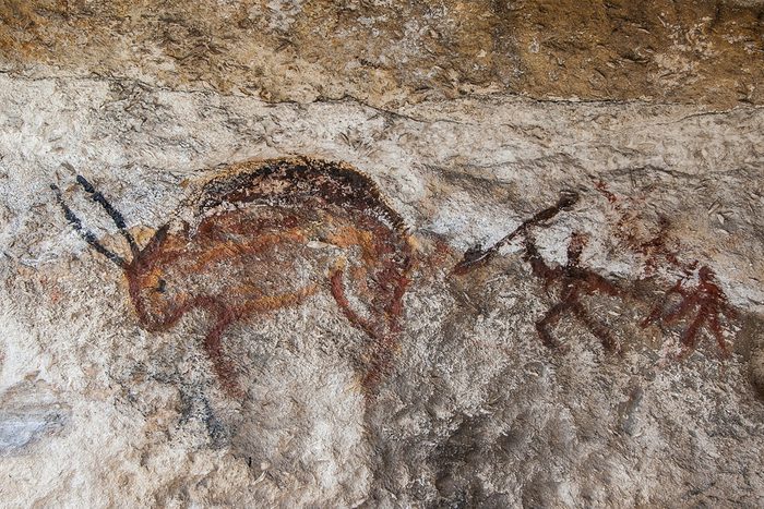 Wall cave with drawings of the primitive person.