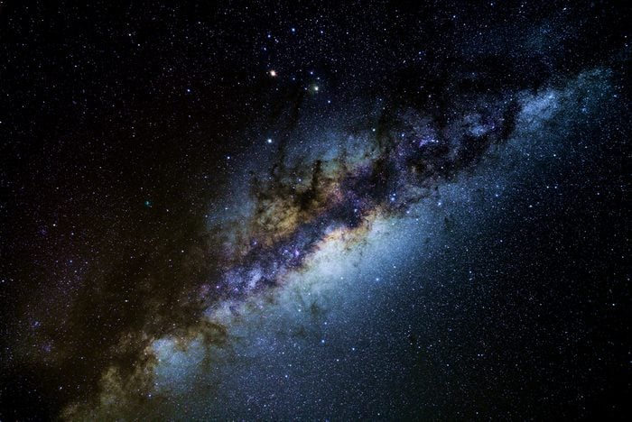 The core of our Milky Way galaxy in the dark skies of Atacama Desert. Planets Mars and Saturn form a bright triangle with Antares, the scorpion's heart. Comet 252P/LINEAR is left of and below Saturn.