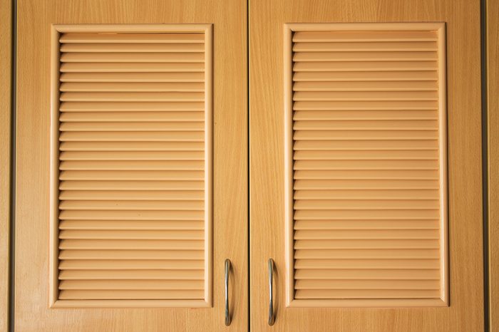Wooden door of wardrobe in kitchen for being design interior of creative background, with flat pattern in surface 