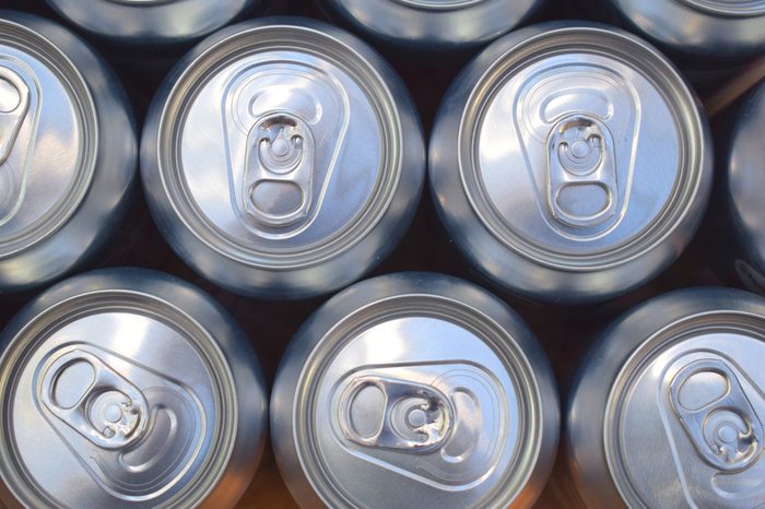 Aluminium Carbonated Drinks Cans Lined Up In Pattern And Photographed From Above