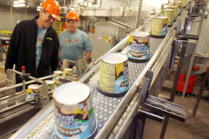 Ice cream moves along the production line at Ben & Jerry's Homemade Ice Cream in Waterbury, Vt. Ben & Jerry's is cutting about two dozen jobs at its Waterbury plant as part of a restructuring of its Vermont ice cream making operations