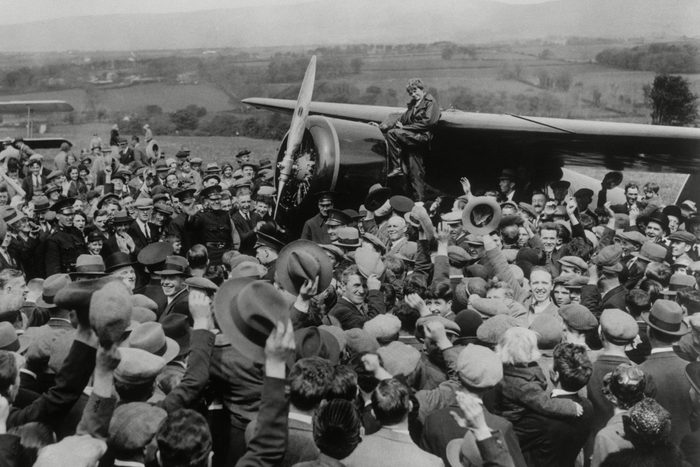 Mandatory Credit: Photo by Anonymous/AP/Shutterstock (7391973a) A crowd cheers for aviatrix Amelia Earhart as she boards her single-engine Lockheed Vega airplane in Londonderry, Northern Ireland, for the trip back to London on . Earhart became the first woman to fly solo nonstop across the Atlantic Ocean when she finished her 2,026 mile journey on May 21, 1932 in under 15 hours after departing from Harbour Grace, Newfoundland. Earhart vanished mysteriously over the Pacific during her attempted round-the-world flight in 1937 Amelia Earhart Solo Flight, Londonderry, United Kingdom