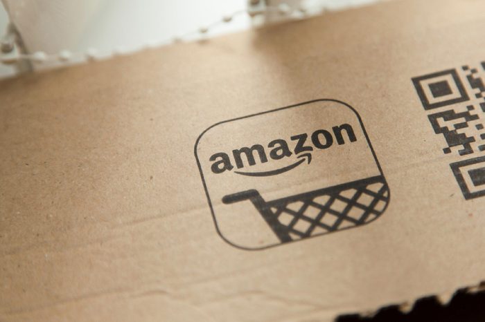 Amazon logo on a parcel. Amazon is the largest online retailer in the world and was founded in 1994