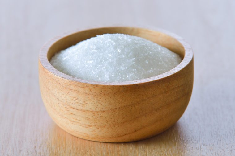 Monosodium glutamate in wooden bowl