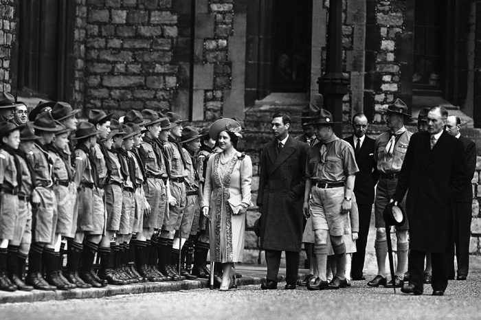 Britain's King George VI and Queen Elizabeth inspects the ranks of Scouts at the National Boy Scout rally in the grounds of Windsor Castle, on St. George's Day, . The royal family reviewed the Scouts before the dedication service to scout ideals in the chapel of St. George, attached to the castle. Scout troops and old Scouts attended the rally. This year great weight was given to the dedication service by the movement, at a time when, they feel, the Scout spirit is most wanted in the world