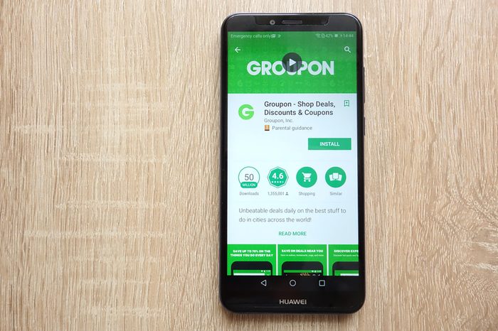 KONSKIE, POLAND - JUNE 17, 2018: Groupon - Shop Deals, Discounts and Coupons app on Google Play Store website displayed on Huawei Y6 2018 smartphone