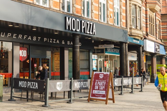 People walk past MOD Pizza restaurant in Nottingham. In Nottingham, England. On 13th February 2017.