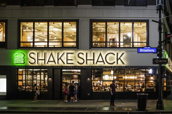 Shake Shack near Herald Square in Manhattan. Shake Shack is a trendy food chain known for quality. People can be seen.