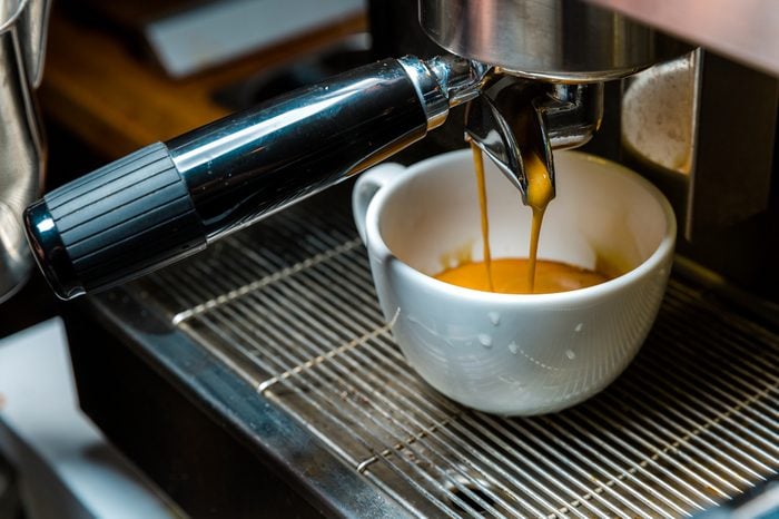 Brewing coffee from an espresso machine to a mug