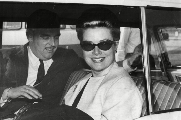 Prince Rainier Of Monaco With Wife Princess Grace / Grace Kelly In Car Leaving London Airport 1963.