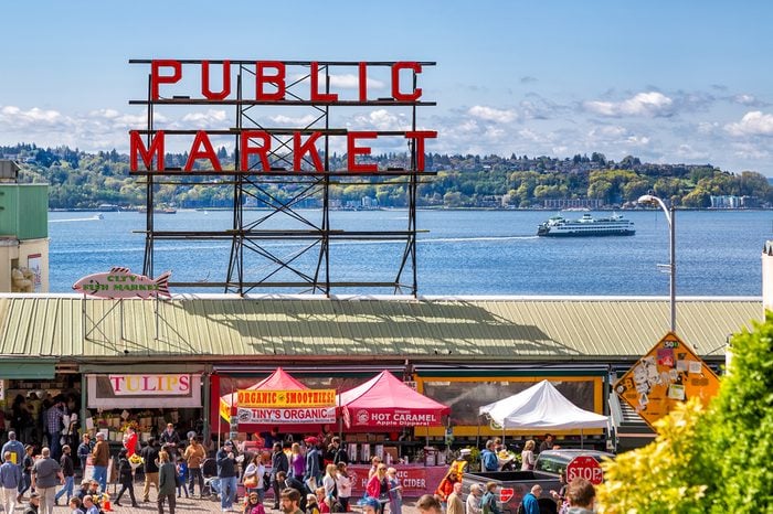 SEATTLE-APR 12, 2014: Historic Pike Place Public Market is one of the top attractions in Seattle, where locals and tourists shop for locally sourced, artisanal and specialty foods, flowers and crafts.