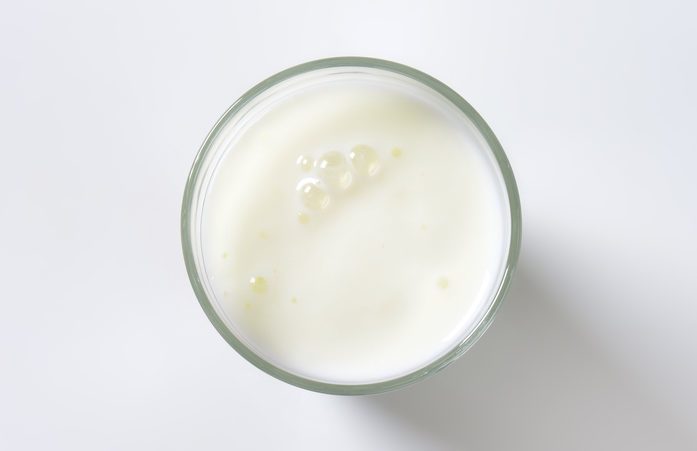 glass of milk on white background