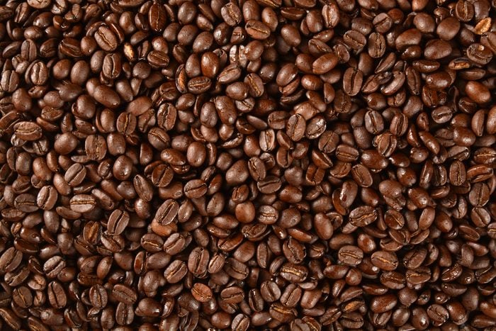 Dark roasted coffee beans from an overhead angle