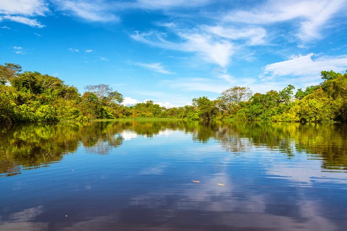 Sky being reflected in the Javari River in the Amazon rain forest