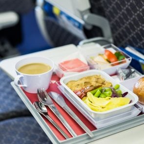 Food served on board of economy class airplane on the table