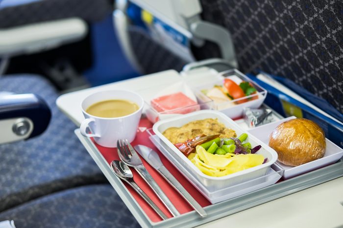 Food served on board of economy class airplane on the table