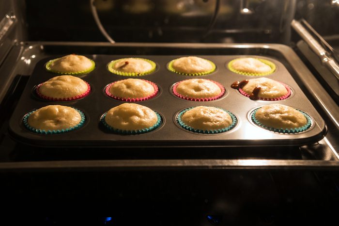 Baking muffins in the oven. Horizontal image.