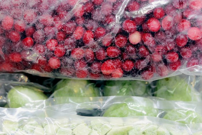 Organic frozen whole cranberries and kiwi in vacuum bag