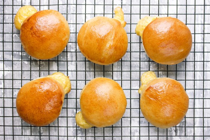 Hot cheese stuffed rolls after baking on cooling rack top view