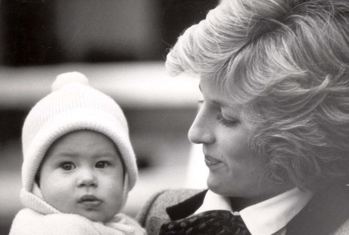 Princess Diana holding Prince Harry 1985