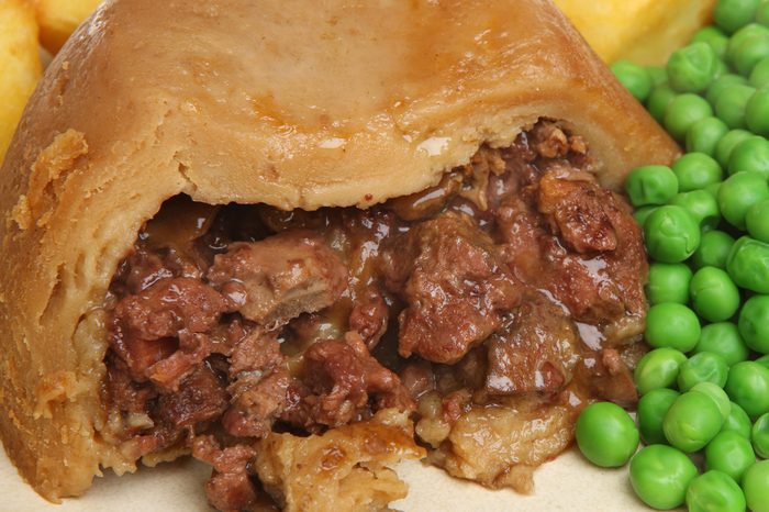 Steak & kidney pudding with peas and potatoes
